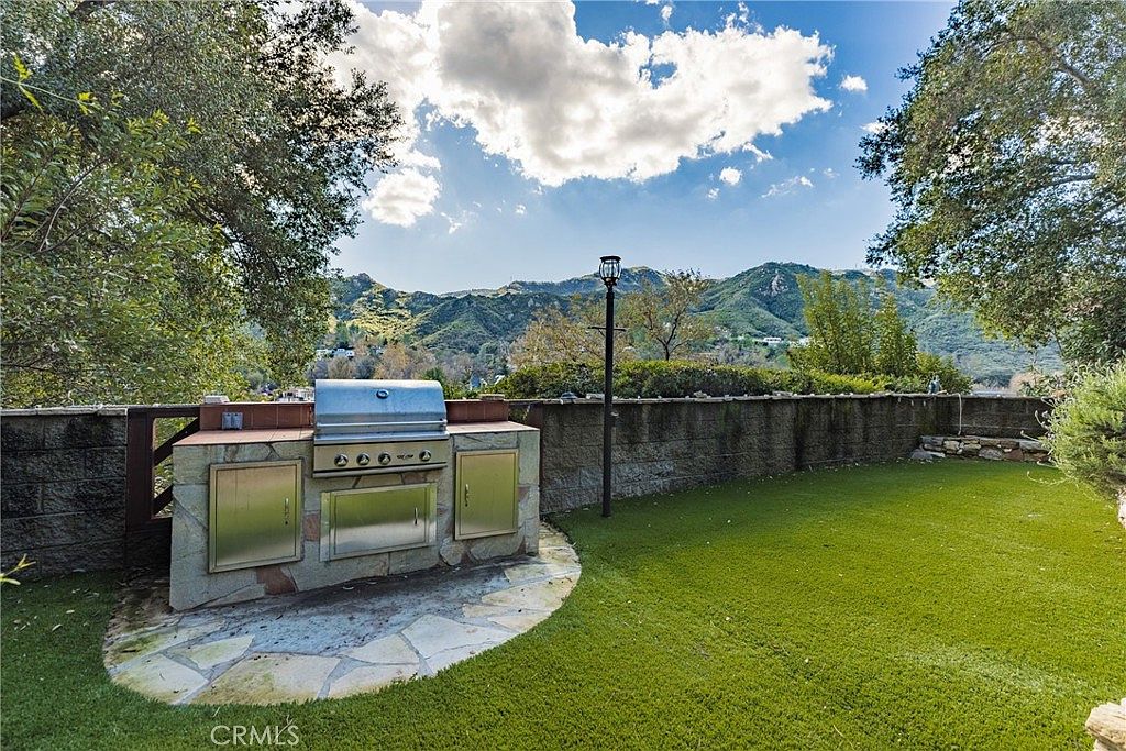 Outdoor grill station with mountain and lake views